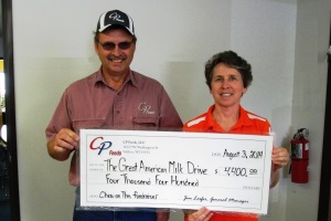 Jim Loefer and Nancy Beckman with a $4400 donation to the Great American Milk Drive